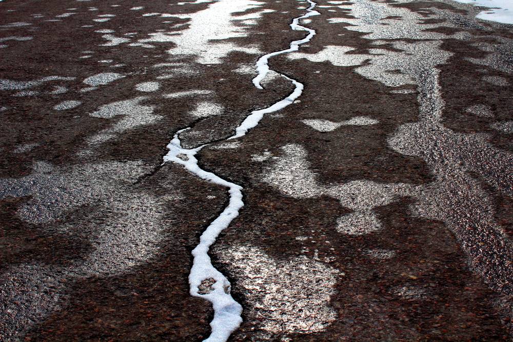 Read more about the article Identifying Frost Heave Damage in Your Asphalt and Concrete Surfaces